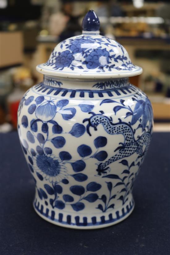 A 19th century Chinese blue and white vase and cover, decorated with dragons height 20cm